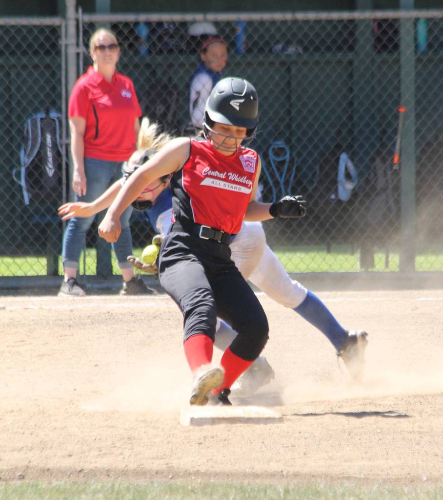 Chloe Marzcocca avoids a tag at second base.(Photo by Jim Waller/Whidbey News-Times)