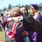 Hallyson Parker embraces an Oak Harbor High School teacher at the conclusion of Saturdays graduation ceremony. Photo by Laura Guido/Whidbey News-Times
