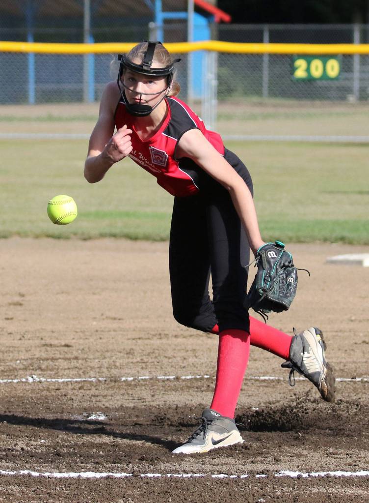 Savina Wells rifles a pitch for Central Whidbey. She struck out six in two innings before leaving with an injury.(Photo by John Fisken)
