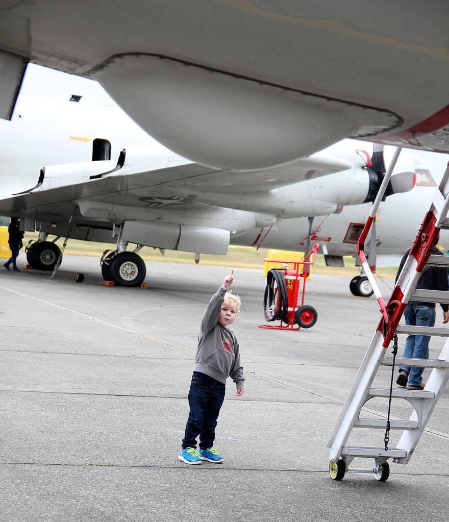 Photo by Laura Guido/Whidbey News-Times                                Daniel Spade, 2, peers up at a P-3C Orion during this years open house Saturday at Ault Field. The event offers a rare opportunity to get an up close look at the aircraft and other equipment used at Naval Air Station Whidbey Island.