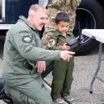 Photo by Laura Guido/Whidbey News-Times                                Andrew Bennett helps his 3-year-old son Kai Bennett to operate an explosive ordnance disposal robot Satuday at the Navy open house.