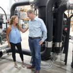 Dan and Kristen Ollis talk coffee in the roasting room.
