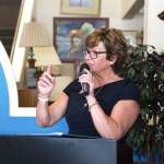 Oak Harbor Chamber of Commerce Executive Director Christine Cribb speaks at a recent event at the Habitat for Humanity storein Oak Harbor. The nonprofit is launching its Cost of a Home campaign to bring awareness to the need for affordable housing. (Photo by Laura Guido/Whidbey News-Times)