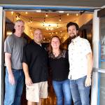 From left, board of directors member Randy Urquhart, owner Mitch Aparicio, events coordinator Dena Marie and business operations manager Scott Baxter stand outside the new Penn Cove Taproom in Oak Harbor. Photo by Laura Guido/Whidbey News-Times