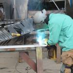 A welder does work on a high-speed passenger ferry that Nichols Brothers is building for Kitsap Transit. (Photo by Jessie Stensland / Whidbey News-Times)