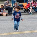 Lucas Handke, 2-and-a-half-years-old, dances before the parade begins.