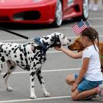 Madisyn Stratton, 5, pets furry parade participants Thursday. (Photos by Maria Matson/Whidbey News-Times)