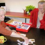 At the Giraffe Heroes Project office in Langley, co-leaders Ann Medlock and John Graham discuss contents of a resource kit for elementary schools. (Photos by Dave Felice / Whidbey News-Times)