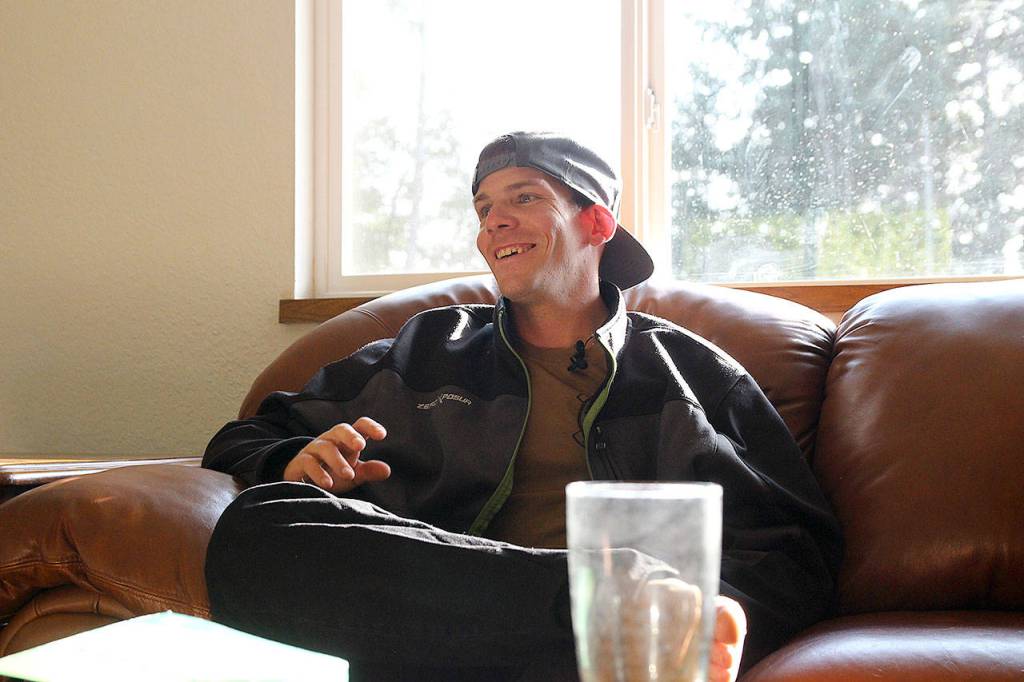 Jakes House resident Chad Wood speaks at a recent house meeting. He is the newest resident at the North Whidbey sober house, operated by Mighty to Save Ministries.