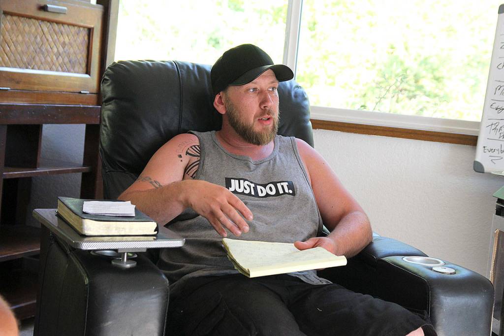 Jonathan Forbes leads a discussion Monday evening at Jakes House. He is a live-in advisor for the North Whidbey sober home.