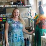 Tina Shorey with Rusty the Rooster, the stores mascot. He gets dressed up for various holidays, and just for fun too. (Photos by Maria Matson/South Whidbey-Record)
