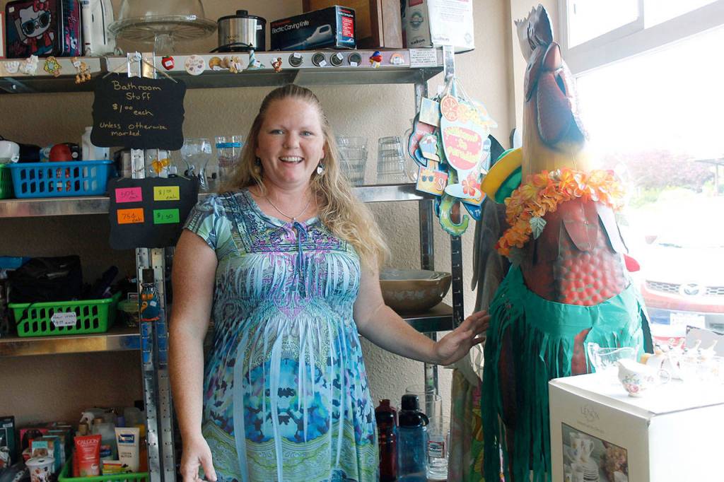Tina Shorey with Rusty the Rooster, the stores mascot. He gets dressed up for various holidays, and just for fun too. (Photos by Maria Matson/South Whidbey-Record)