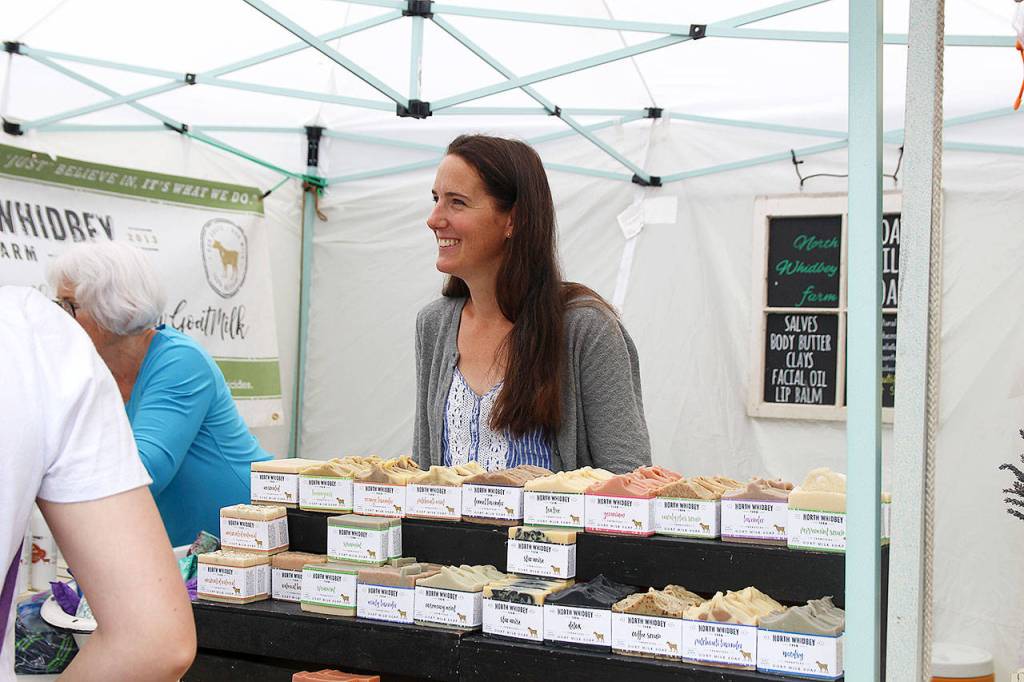 Kimberly Christensen of North Whidbey Farm speaks to visitors on the second day of the Coupeville Arts and Crafts Festival.