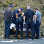 Photo by Laura Guido/Whidbey News-Times                                First responders secure a woman on a stretcher after a motorcycle accident Wednesday on Libbey Road.