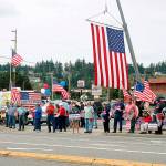 Supporters wave flags and signs in support of Navy at weekend rally