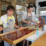 Siblings 13-year-old Jack Culligan and 16-year-old Cate try their hand at marbling a scarf. (Photos by Maria Matson/Whidbey News-Times)