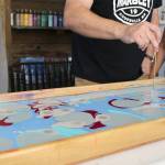 Ed Hodson and Joan Samson demonstrate the water marbling process.