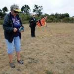 Whidbey Island Kite Fliers and festival organizers Lisa Root, left, and Linda Barnes work on getting a kite off the ground at Fort Casey. (Photos by Maria Matson/Whidbey News-Times)