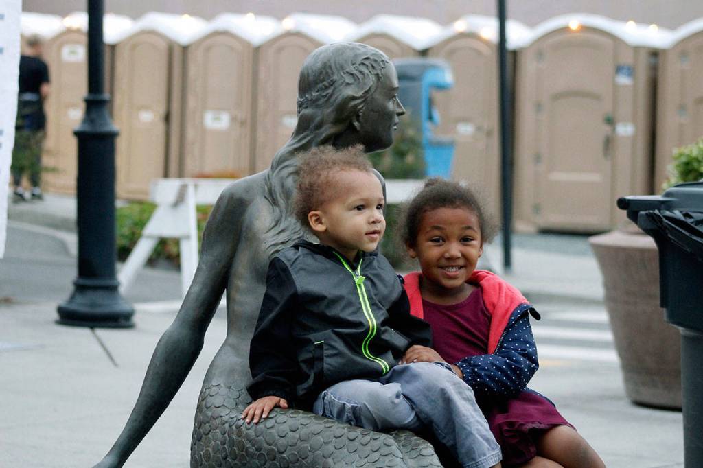 Owen DuBois, 2, and his sister Olivia, 5, of Oak Harbor, had fun on Friday attending the festival with their family.