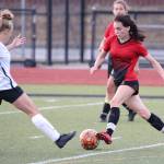Mallory Kortuem, right, gets to the ball first for Coupeville in Thursdays jamboree.(Photo by John Fisken)