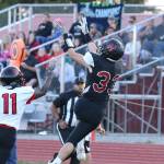 Gavin Knoblich hauls in a pass from Dawson Houston in Coupevilles season opener Friday. (Photo by John Fisken)