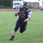 Andrew Martin picks up some yardage for the Wolves.(Photo by John Fisken)