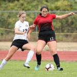 Carolyn Lhamon, right, takes control of the ball.(Photo by John Fisken)