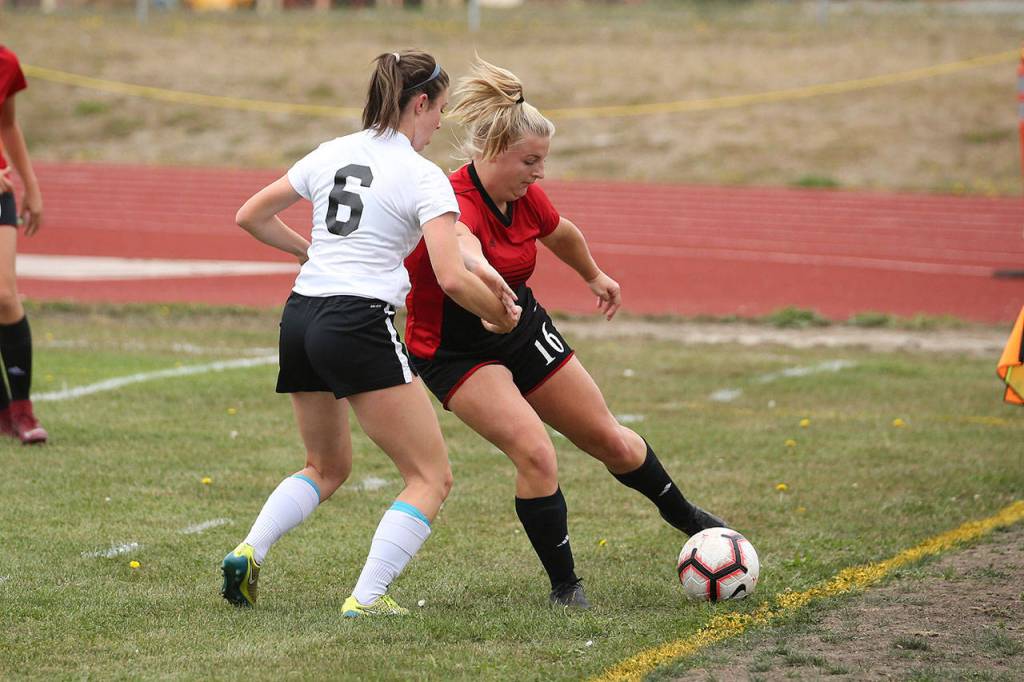 Avalon Renninger, right, works the ball toward the goal.(Photo by John Fisken)