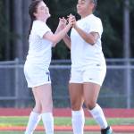 Gracie Hiteshew, left, and Tiana Jackson celebrate an Oak Harbor goal.(Photo by John Fisken)