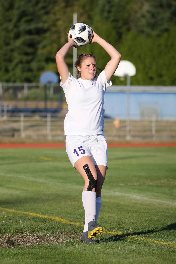 Chloe Wallace tosses the ball in for Oak Harbor.(Photo by John Fisken)