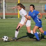 Chloe Wallace, left, beats South Whidbeys Alison Papritz to the ball.(Photo by John Fisken)