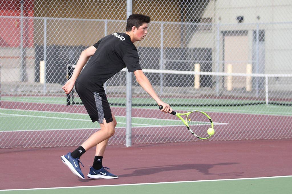 James Wood flips a backhand over the net.(Photo by John Fisken)