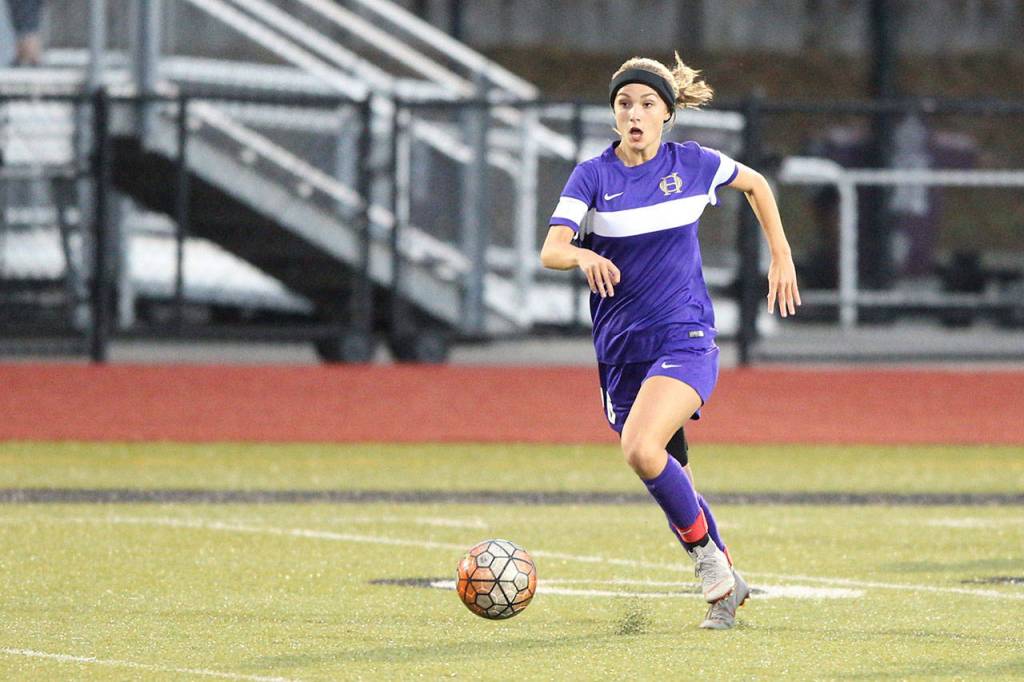 Cassie Stady advances the ball for the Wildcats.(Photo by John Fisken)