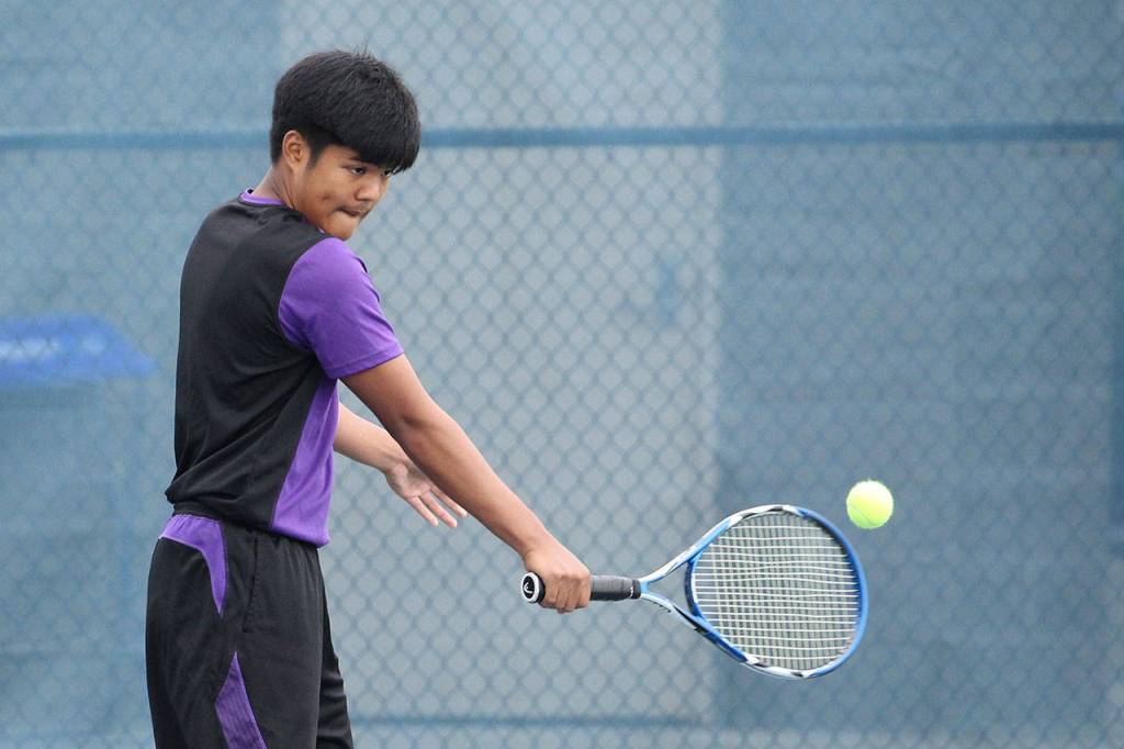 Yuji Caballero strokes a backhand.(Photo by John Fisken)
