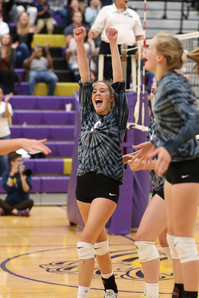 Leielle Salinger and Lacey Zylstra (right) enjoy a Wildcat point.(Photo by John Fisken)
