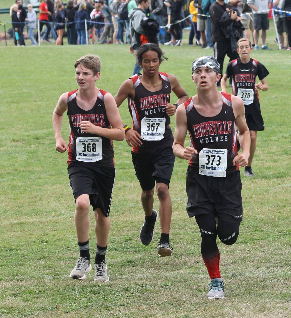 Coupevilles Cameron Epp, left, Reiley Acaceley, Chris Ruck and Tate Wyman head up the hill at the Westling Invitational. (Photo by Jim Waller/Whidbey News-Times)