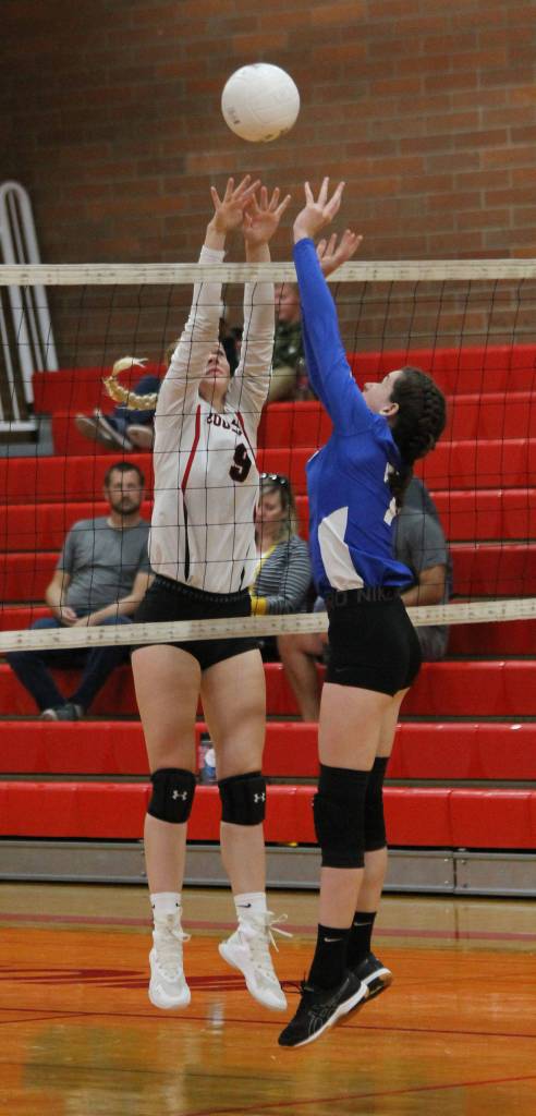 Chelsea Prescott, left, challenges a Chimacum player at the net.(Photo by Jim Waller/Whidbey News-Times)