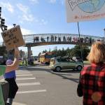Approximately 200 people gathered Friday on each corner of the intersection of Main Street and State Highway 20 in Coupeville to join the global protest to encourage policymakers to take action regarding climate change. Photo by Laura Guido/Whidbey News-Times