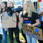 Oak Harbor High School student Ella Langrock, 17, leads a chant Friday afternoon during a climate protest in Coupeville. To Langrocks right are Tara Sullivan, Gracie Hiteshew and Hannah Rogers. Photo by Laura Guido/Whidbey News-Times