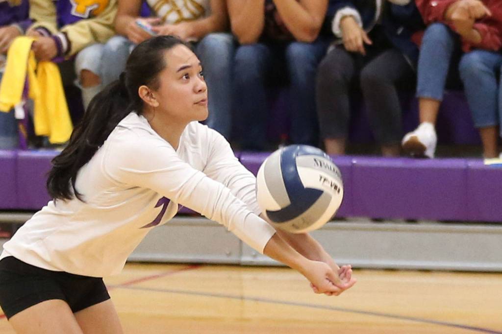 Gredina DeGuzman passes the ball for the Wildcats.(Photo by John Fisken)
