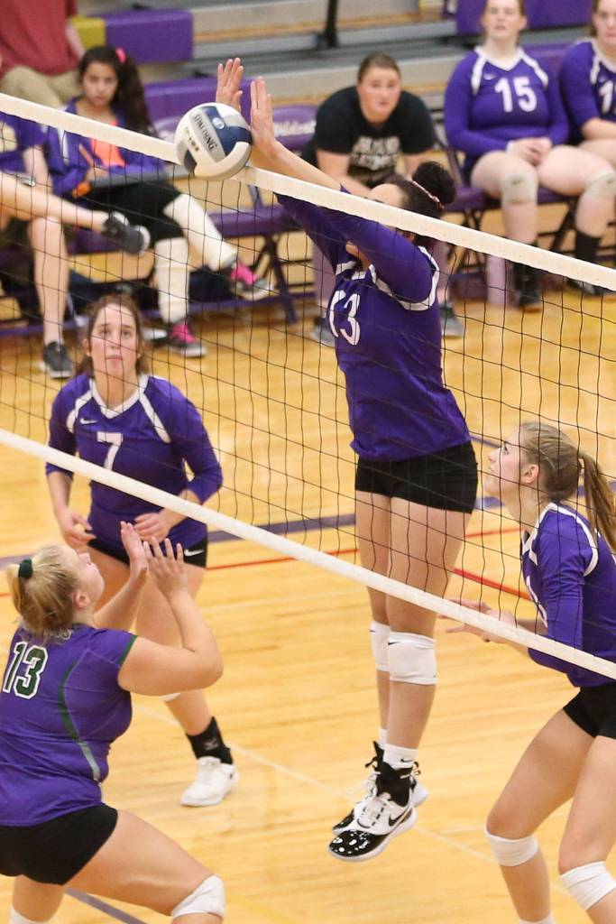Jasmine Ford blocks an Edmonds-Woodway hit.(Photo by John Fisken)