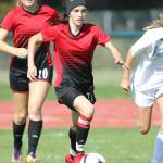 Mallory Kortuem races the ball up the field.(Photo by John Fisken)