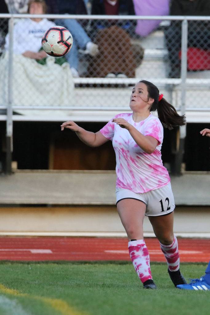 Carolyn Lhamon runs down the ball for the Wolves.(Photo by John Fisken)