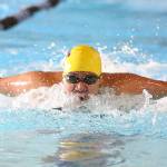 Grace Chargualaf competes in the 100-meter butterfly for the Wildcats. (Photo by John Fisken)