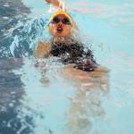 Frances Empinado swims the backstroke leg of the individual medley.(Photo by John Fisken)