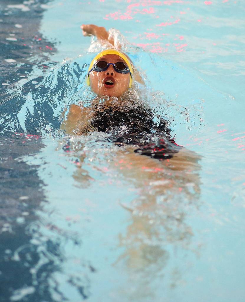 Frances Empinado swims the backstroke leg of the individual medley.(Photo by John Fisken)