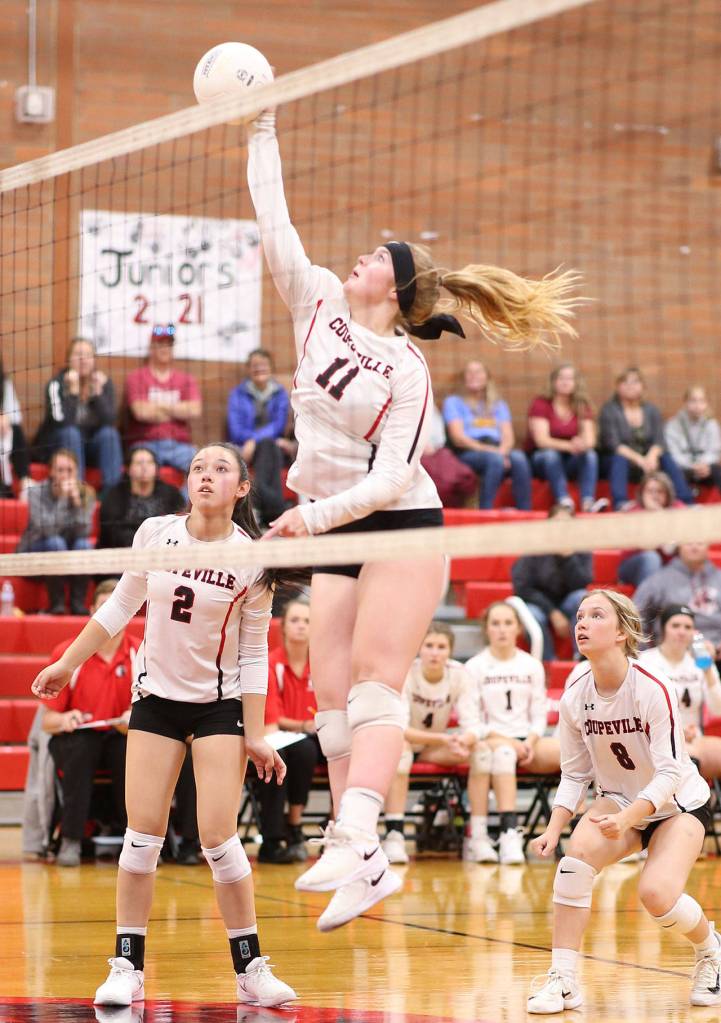 Hannah Davidson goes for the kill for Coupeville. (Photo by John Fisken)
