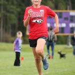 North Whidbey Middle Schools Addisen Boyer hustles to the finish line in first place in the seventh-grade girls race.(Photo by John Fisken)