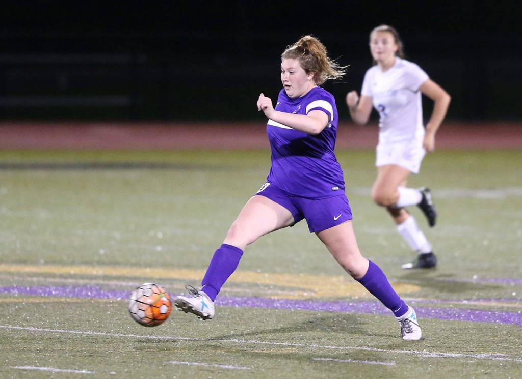 Morgan Lamar takes possession for Oak Harbor. She later scored the game-winning goal for the Wildcats.(Photo by John Fisken)