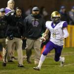 Landon Contrell heads up the sideline for a big gainer.(Photo by John Fisken)